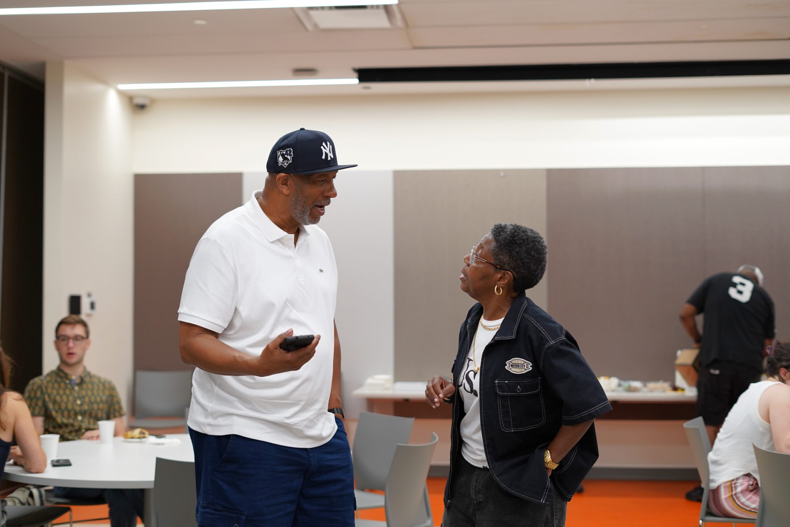 Two participants chatting in the meeting room at a MAHRWC training